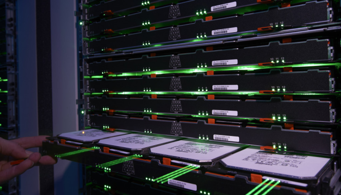 Photo shows a section of a storage rack fully loaded with hard disks.